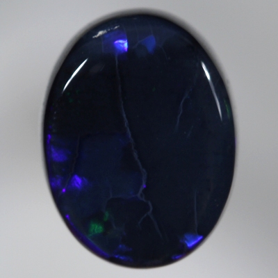 SOLID BLACK OPAL Electric royal blue moves in rolling flashes